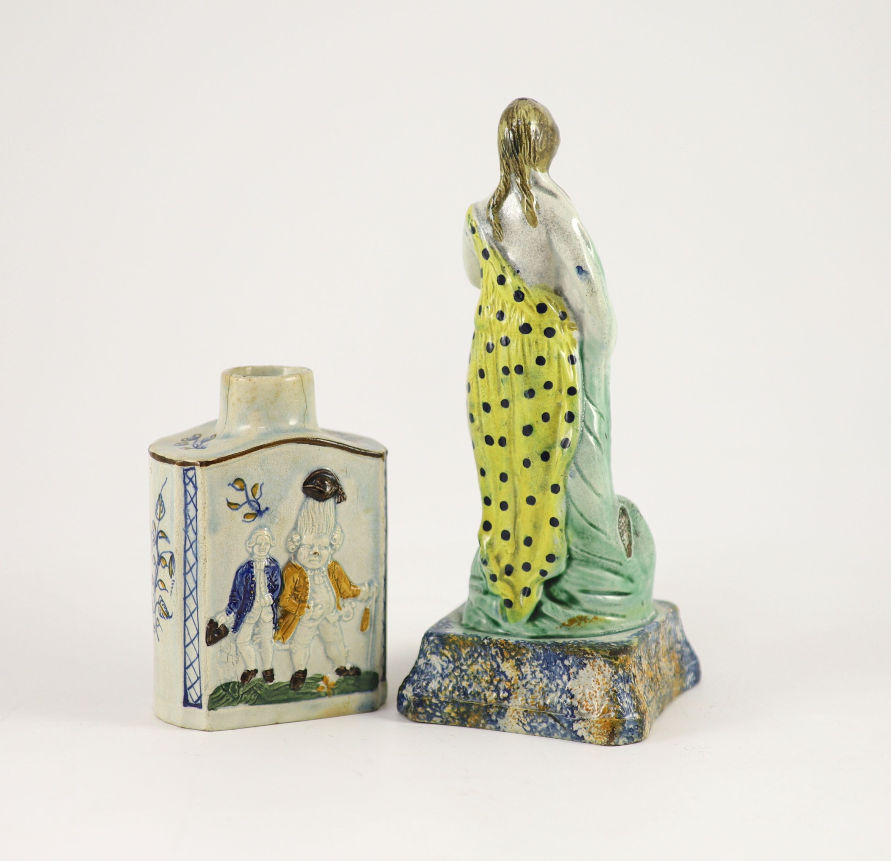 A Staffordshire Prattware pearlware tea caddy and figure of Flora, c.1790, 12.5 and 22cm high
